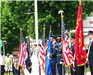 Service members holding flags