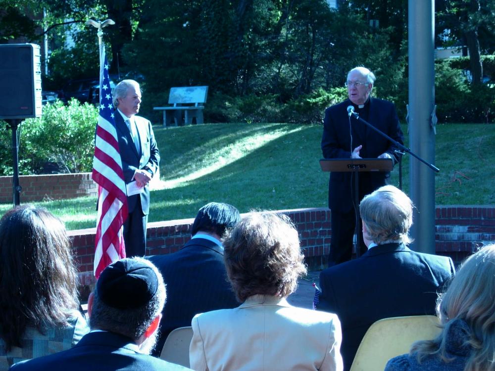 Priest speaking at ceremony